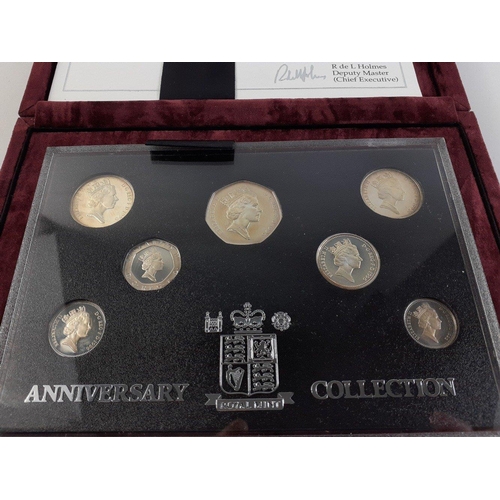 56 - A 1996 United Kingdom Silver Anniversary Collection Coin Set No. 10828 in nice plush case with certi... 