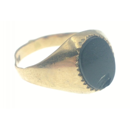 8 - A gold ring stamped 375, set with black stone, size L, gross weight 2.18g approx#8