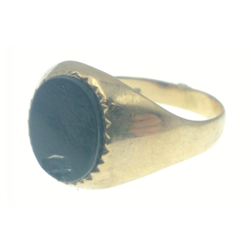 8 - A gold ring stamped 375, set with black stone, size L, gross weight 2.18g approx#8