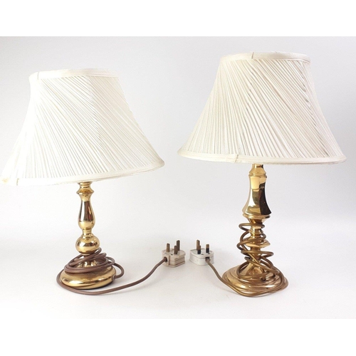 163 - A pair of small brass lamps with red shades, with also 4 other brass effect table lamps with shades ... 