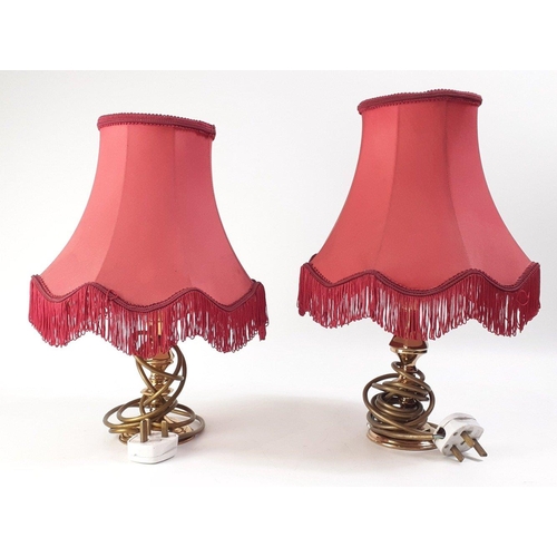 163 - A pair of small brass lamps with red shades, with also 4 other brass effect table lamps with shades ... 