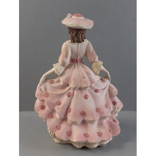 256 - A COALPORT Beau Monde Elizabeth figurine with matte finish.  Stands 14cm high approx.  Boxed with no... 