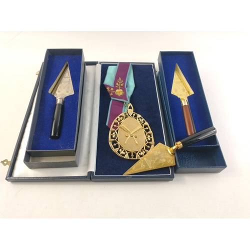 90 - A large gilt metal Masonic pendant (12cm length approx) in box with ribbon. Also three presentation ... 