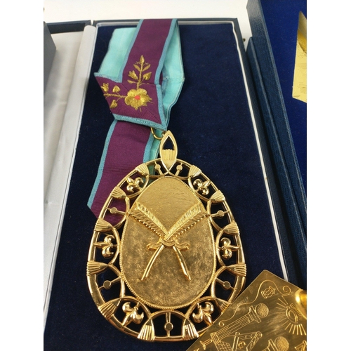 90 - A large gilt metal Masonic pendant (12cm length approx) in box with ribbon. Also three presentation ... 