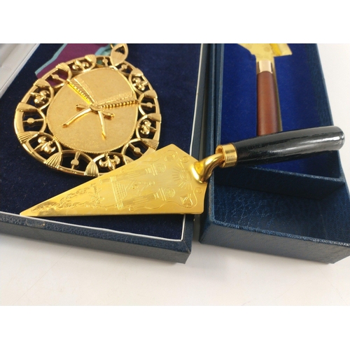 90 - A large gilt metal Masonic pendant (12cm length approx) in box with ribbon. Also three presentation ... 