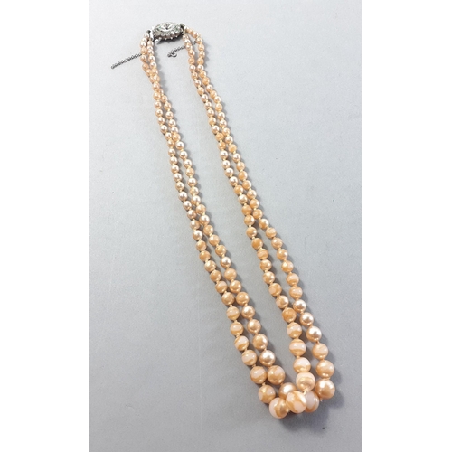 111 - A twin strand string of LORUS pearls with silver fastener. 40cm approx#111