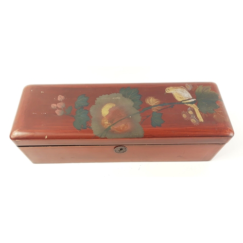 114 - A nice quality lacquered long rectangular lidded box to include some interesting costume jewellery, ... 