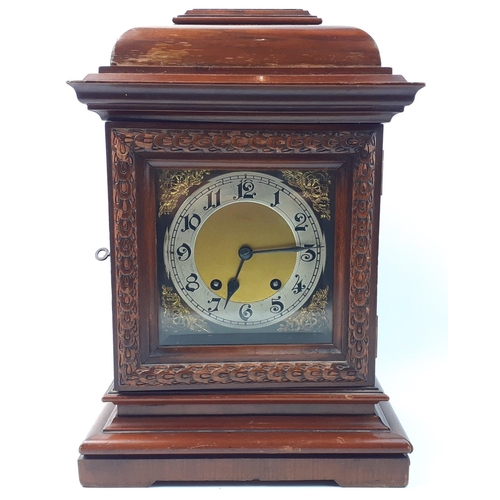 156 - An original Edwardian mantle clock with ornate brass face and German mechanism complete with key, pe... 