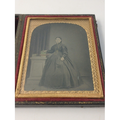 212 - Two antique cased Victorian tin-type studio photographs of stylish ladies.  Frame size 12 x 10cm app... 