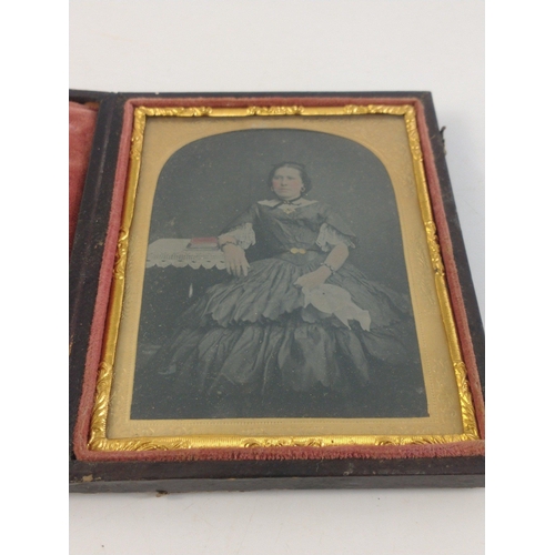 212 - Two antique cased Victorian tin-type studio photographs of stylish ladies.  Frame size 12 x 10cm app... 