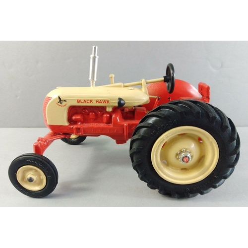 219 - COCKSHUTT BLACK HAWK die cast tractor in cream and red.  Nice solid good quality model, one of the m... 