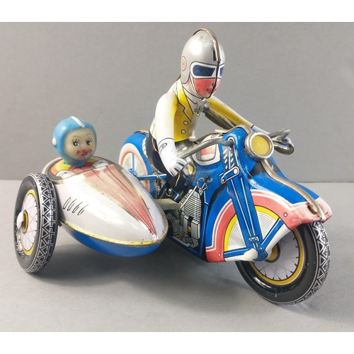 223 - A Chinese made vintage tin-plate motor bike and side-car in working condition.  18cm long approx#224... 