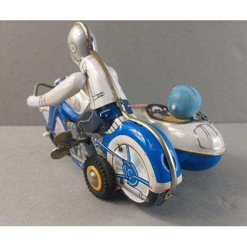 223 - A Chinese made vintage tin-plate motor bike and side-car in working condition.  18cm long approx#224... 