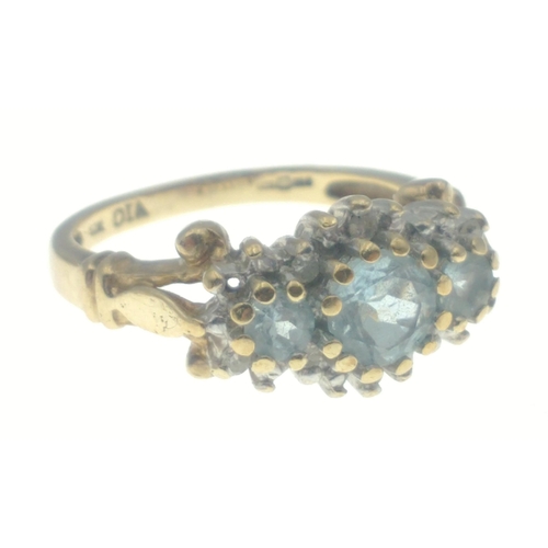 23 - A ladies dress gold ring hallmarked 9ct and stamped 10K set with sky blue topaz and diamond chips (t... 