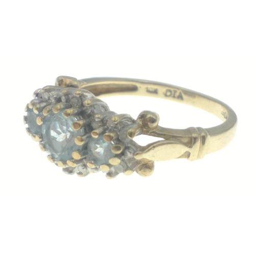 23 - A ladies dress gold ring hallmarked 9ct and stamped 10K set with sky blue topaz and diamond chips (t... 