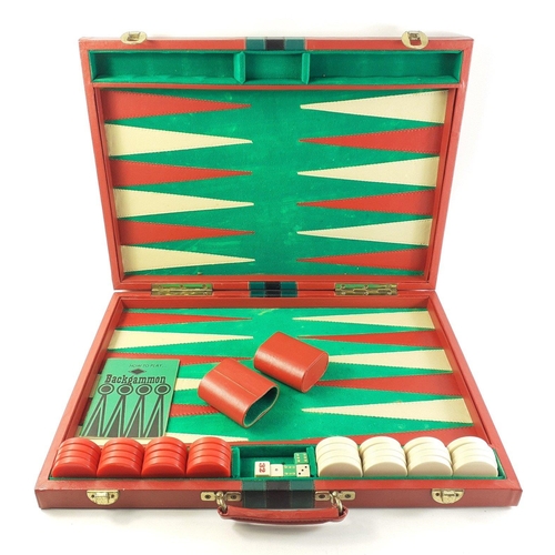 232 - A large backgammon set in soft case complete with dice, shakers, counters etc.  Board measures 78cm ... 