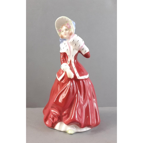 252 - A ROYAL DOULTON lady - Christmas Morn (HN3212). Small size 10cm approx in good condition.#255