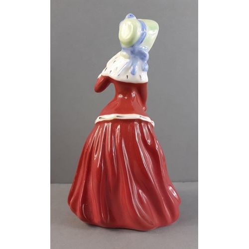 252 - A ROYAL DOULTON lady - Christmas Morn (HN3212). Small size 10cm approx in good condition.#255