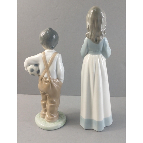 254 - Two NAO figures. One of a young boy with football and one of a young girl cradling a small dog in a ... 