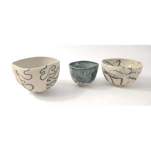 269 - DESIGNER! A quirky studio pottery three finger bowls/coffee cups in varying sizes, each ergonomicall... 