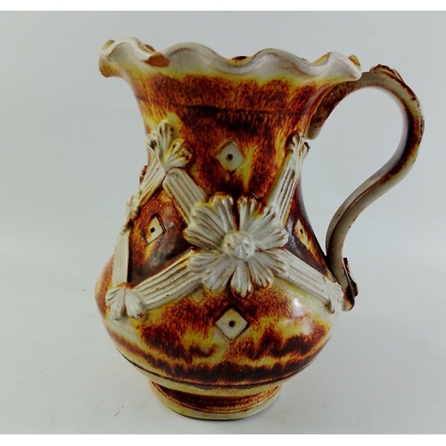 271 - An Italian jug shaped vase with attractive earthy floral pattern.  Stands 20cm high approx.  Chip no... 