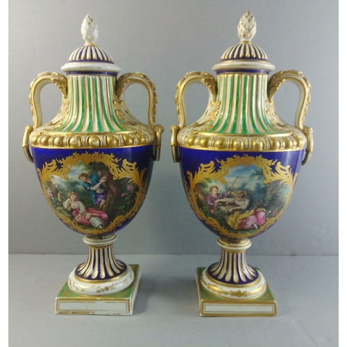 288 - A pair of SEVRES 19th century lidded urns with courting scenes. Each standing 38cm to finial. Histor... 