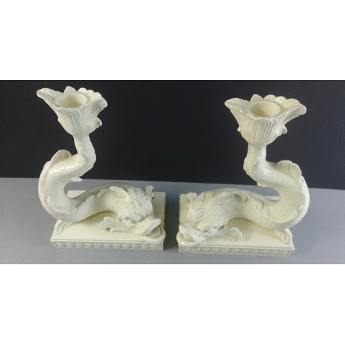 289 - A pair of WEDGWOOD white porcelain Dolphin Candlesticks. W17 x H24cm approx. A wonderfully sculpted ... 