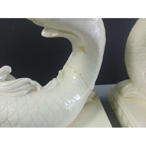 289 - A pair of WEDGWOOD white porcelain Dolphin Candlesticks. W17 x H24cm approx. A wonderfully sculpted ... 