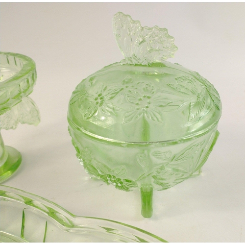 324 - Green glass dressing table set with floral and butterfly embossed design to include a tray (approx 3... 