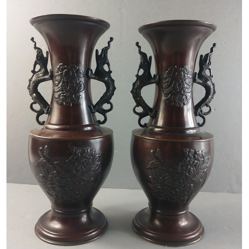 343 - A pair of bronze Oriental vases with dragon handles, each 31cm tall approx.#347