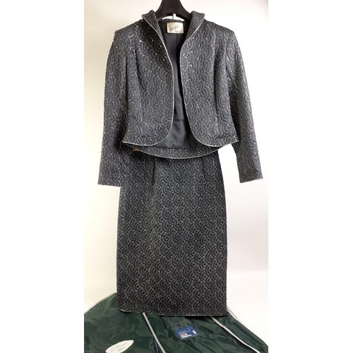 436 - A WAYNE CLARK Aline Marelle suit in black with short quilted jacket and skirt, in black with silver ... 