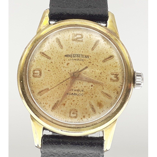 50 - A WINEGARTEN'S of London 17 jewels Incabloc classic gent's watch.  Face with discolouration.  Not cu... 