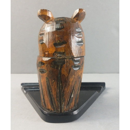 561 - A lovely wooden carved owl with an interior ceramic ink pot (damaged) sitting on a wooden desk pen h... 