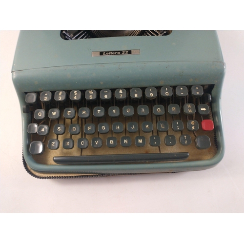 562 - A vintage LETTERA 22 portable typewriter in case.  Case with wear, typewriter appears to be in good ... 