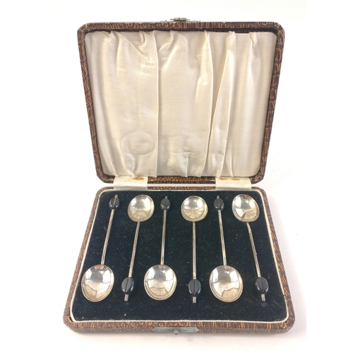 64 - A boxed set of 6 coffee bean spoons hallmarked Birmingham 1930, gross weight 33g approx#64