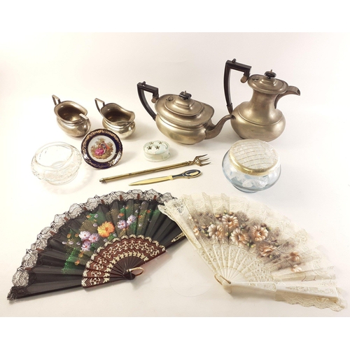 71 - A silverware lot to include a teapot, sugar and cream and other decorative items#71