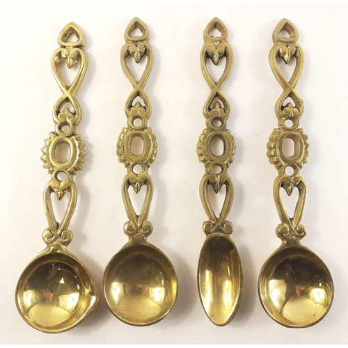 81 - A set of four brass Welsh love spoons. Each 25cm approx.#81