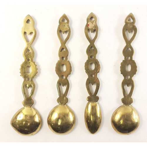 81 - A set of four brass Welsh love spoons. Each 25cm approx.#81