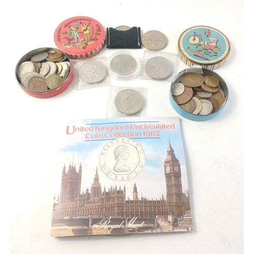 91 - A collection of coins of interest to include UK 1982 coin set, various Crowns, and 2 tins containing... 