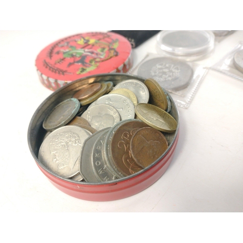 91 - A collection of coins of interest to include UK 1982 coin set, various Crowns, and 2 tins containing... 