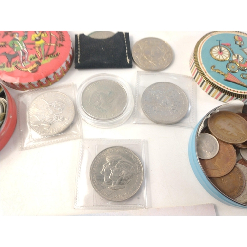 91 - A collection of coins of interest to include UK 1982 coin set, various Crowns, and 2 tins containing... 