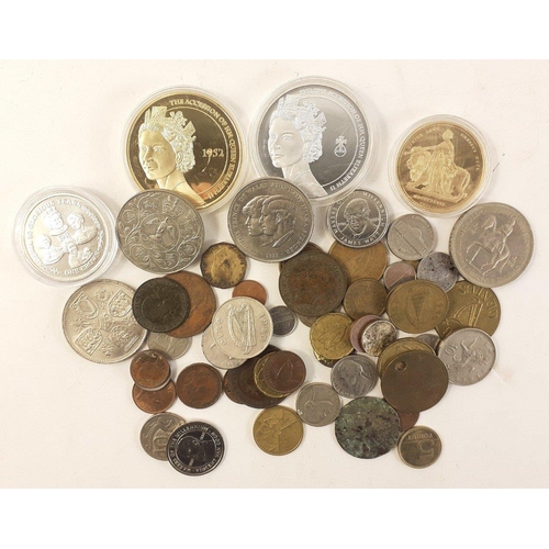 92 - A tin containing coins of interest including some modern crowns and plated coins and a selection of ... 