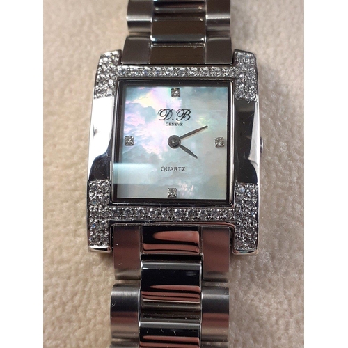 128 - D BARUNE DB 9266SL Boxed Ladies wrist watch with mother of pearl 15mm dial and diamond encrusted bez... 