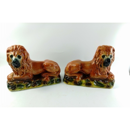 242A - A pair of MAGNIFICENT recumbent Staffordshire ceramic mantlepiece lions. Each measures 34cm x 26cm  ... 