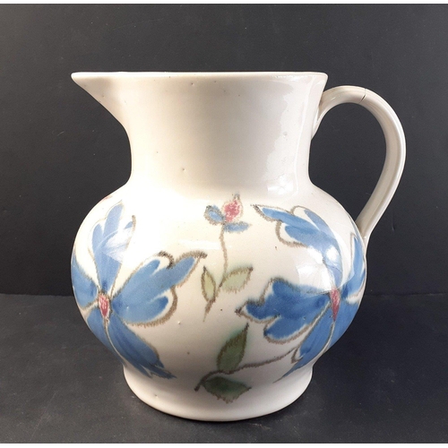 267 - A BUCHAN of Portobello jug (18cm tall) with attractive floral colourway and with some light hairline... 