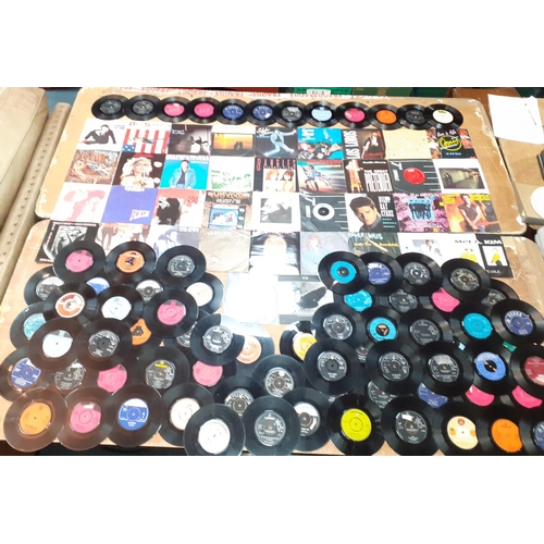 363 - A selection of 45 RPM single vinyl records. Most in sleeves, mainly 1980s.  Blondie, Feargal Sharkey... 