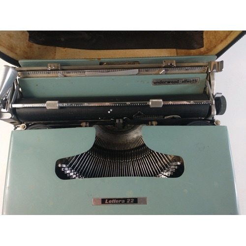 562 - A vintage LETTERA 22 portable typewriter in case.  Case with wear, typewriter appears to be in good ... 