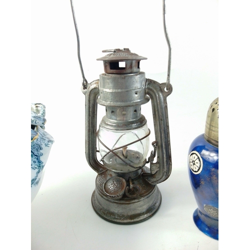 495 - A small mixed lot to include a small oil lamp, urn shaped sugar shifter (18cm tall), a blue and whit... 