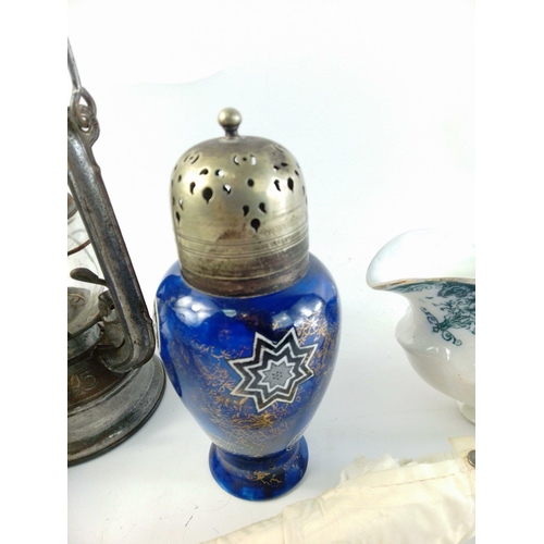 495 - A small mixed lot to include a small oil lamp, urn shaped sugar shifter (18cm tall), a blue and whit... 