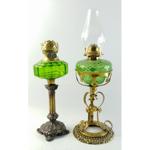 200 - Two oil lamps with green reservoirs. One with ornate antique brass stand standing approx 48cm approx... 